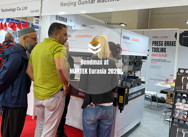 Visitors discussing press brake tooling and clamping solutions at the Bendmax booth during MAKTEK Eurasia 2026